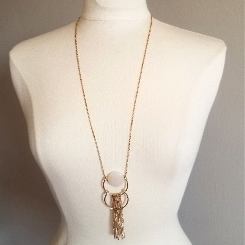 Gold pendant necklace with stone